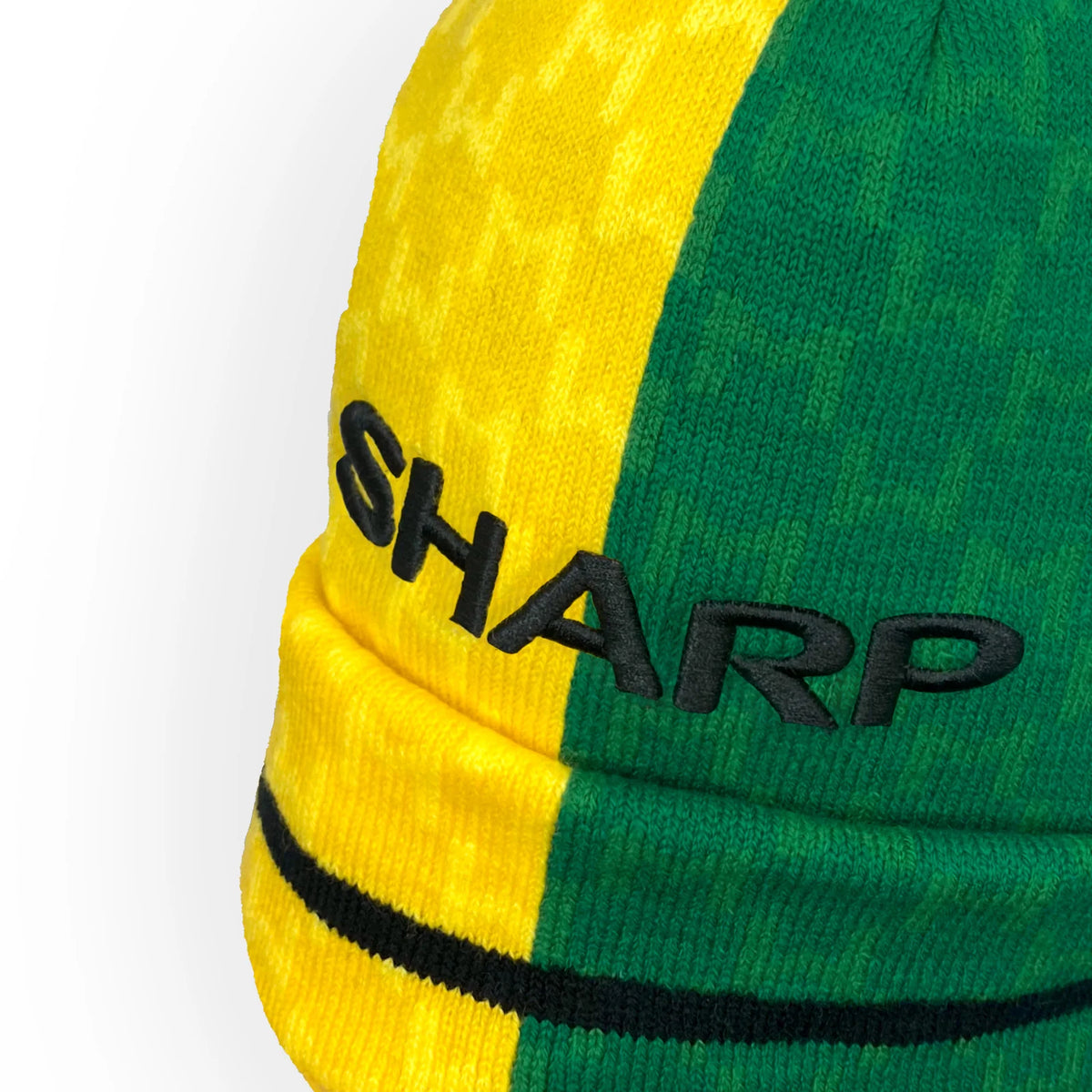 Retro strikket bobble-hue i klubfarver