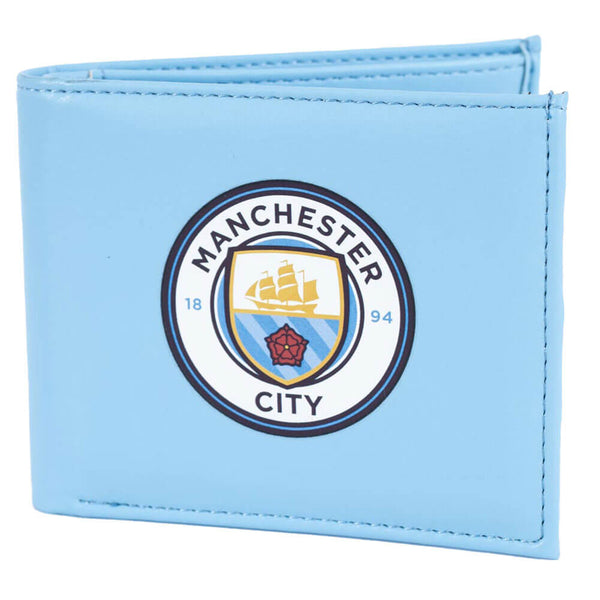 Blå pung med Manchester City logo, flere kortlommer og en ID-lomme med plastvindue.