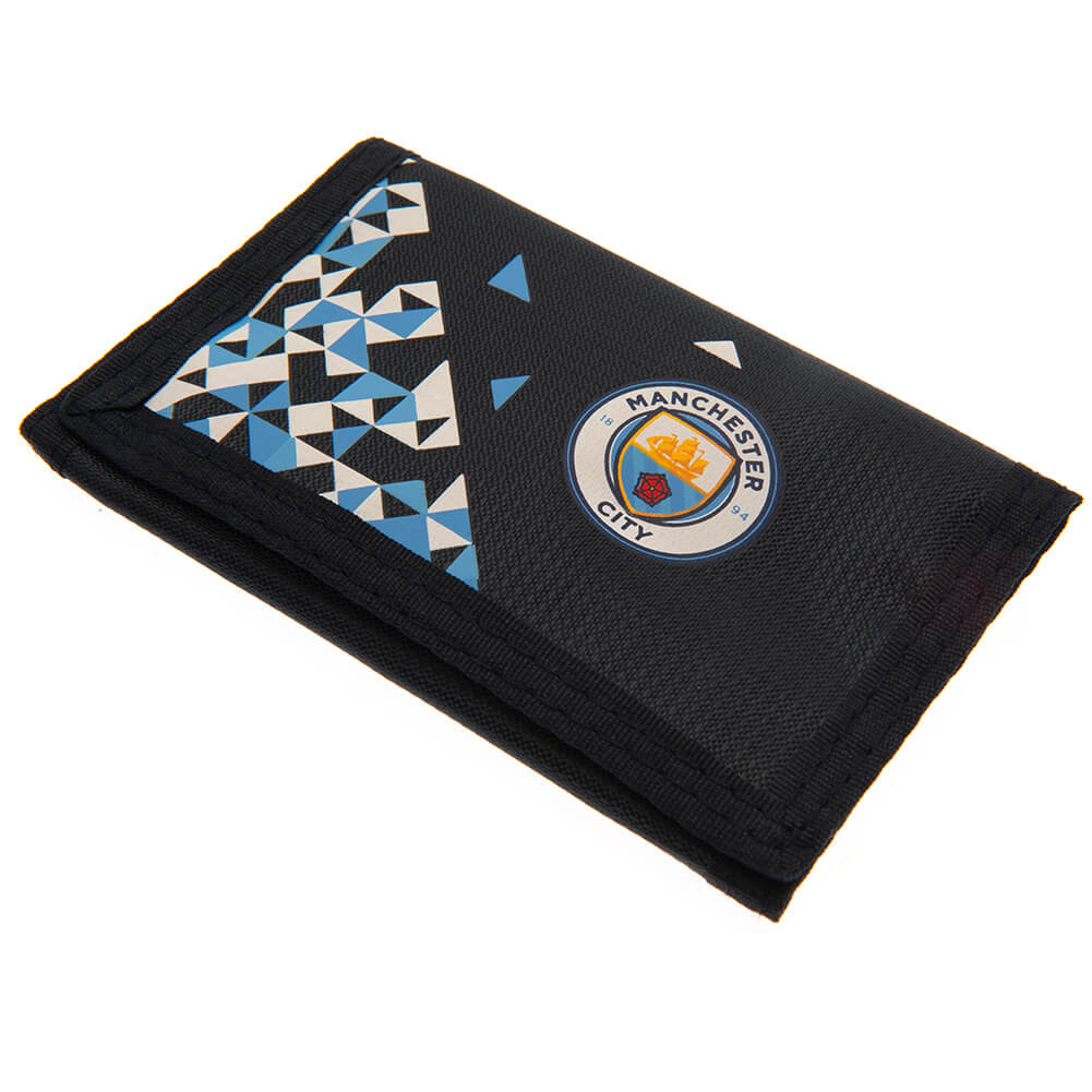Sort pung med Manchester City-emblem og blå-hvide geometriske trekanter. Foldbar med opbevaring.