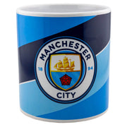 Manchester City jumbo krus med klublogo og blå-sort design.