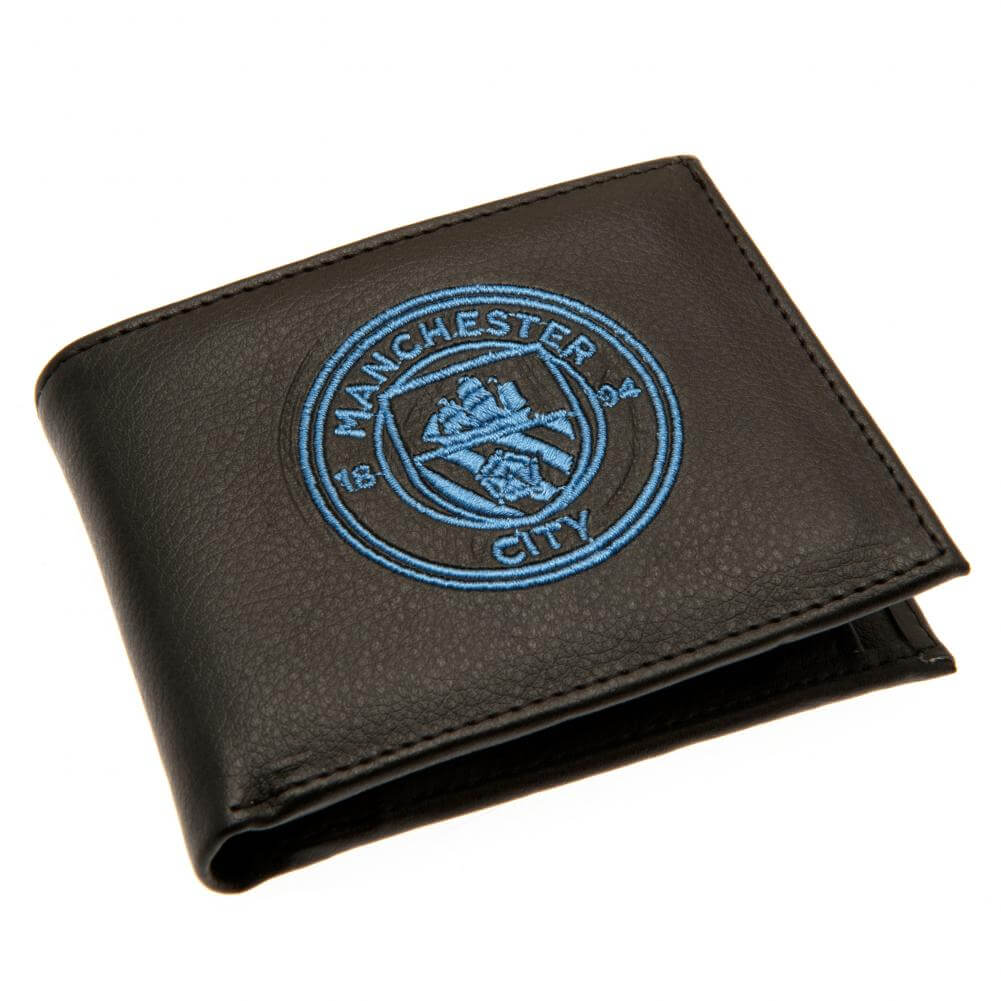 Sort Manchester City pung med blåt broderet logo synligt på forsiden.