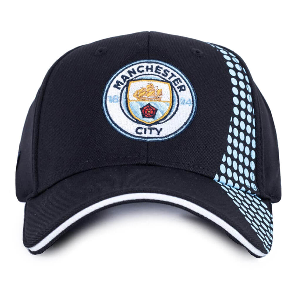 Sort kasket med Manchester City-logo og lyseblå prikket mønster på siden.