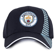 Sort kasket med Manchester City-logo og lyseblå prikket mønster på siden.