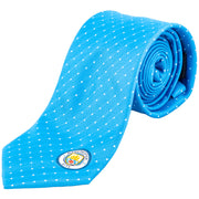Lyseblåt slips med hvide prikker og Manchester City-logo nederst.