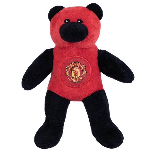 Rød bamse med Manchester United-logo på brystet, sorte ører, arme og ben, samt sorte øjne og næse.