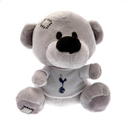 Grå bamse med hvid trøje og Tottenham Hotspur-logo. Synlige sting på hovedet, officiel merchandise.
