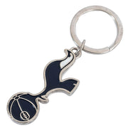 Nøglering med Tottenham Hotspur-logo, fugl over fodbold, i mørkeblå, hvid og sølv på hvid baggrund.