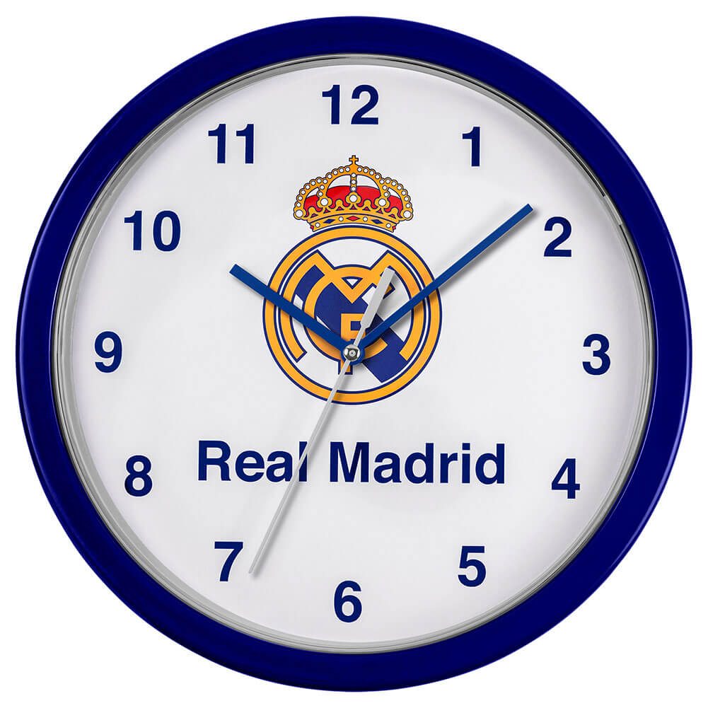 Vægur med blå kant, hvid urskive, Real Madrid logo, og teksten "Real Madrid". Diameter: 24 cm.