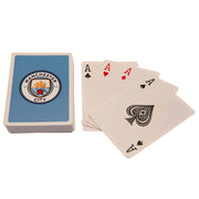 Kortspil med Manchester City FC logo og fire esser: klør, hjerter, ruder og spar.