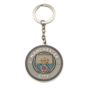 Manchester City FC nøglering med cirkulært design, klublogo, skib, striber og årstallet 1894.