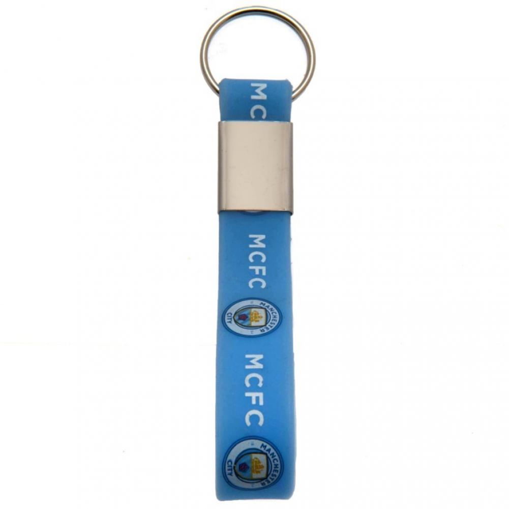 Lyseblå nøglering med "MCFC" i hvid og Manchester City-emblem, fastgjort til metalring.