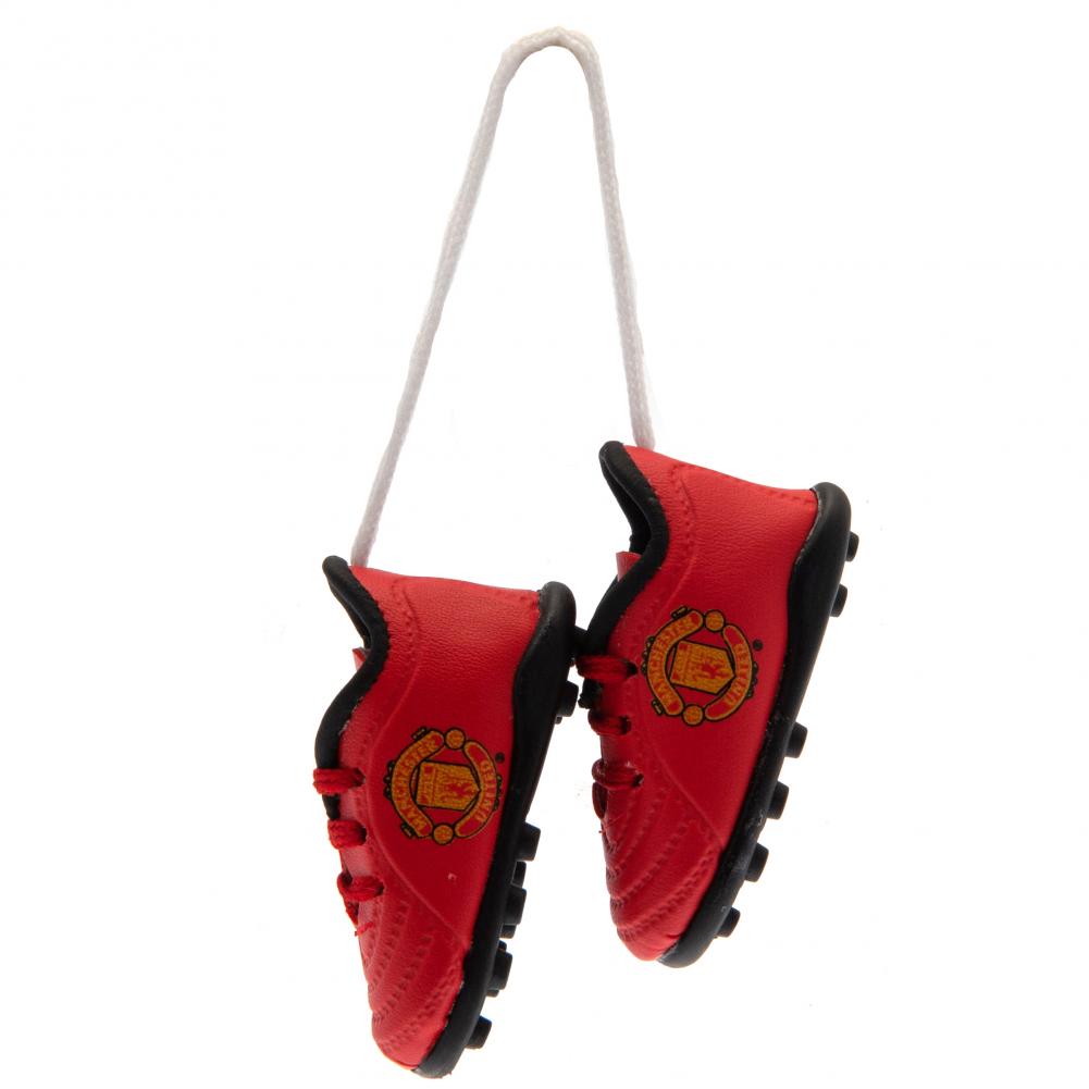 Røde mini fodboldstøvler med sorte detaljer og Manchester United FC-logo, hængende i snor.
