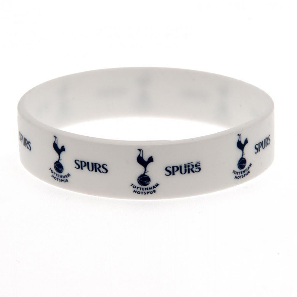 Hvidt armbånd med Tottenham Hotspur logo og ordet "SPURS" gentaget i blåt.