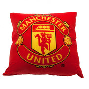 Rød pude med Manchester United-logo i gult og sort, centralt placeret.