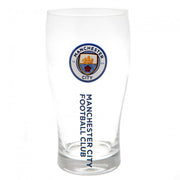 Glas med Manchester City FC-logo og teksten "MANCHESTER CITY FOOTBALL CLUB" vertikalt på siden.