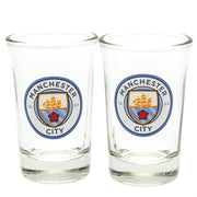 To ens glas med Manchester City FC-logo, klart glas, klassisk form.