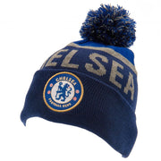 Blå hue med kvast, Chelsea FC-logo og teksten "CHELSEA" foran.