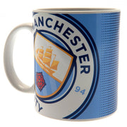 Blå krus med Manchester City FC logo, skib, rød rose og tekst på hvid baggrund.