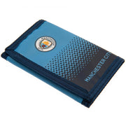 Manchester City FC pung med logo, prikket mønster og synlige syninger.
