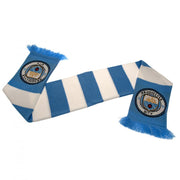 Halstørklæde med lyseblå/hvide striber, frynser og Manchester City FC logo på hver ende.