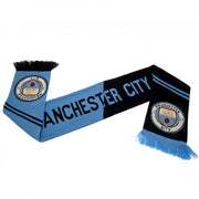Manchester City FC halstørklæde i lyseblå og sort med klublogo og frynser i enderne.
